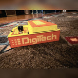 DigiTech MonoNeon Signature Whammy, neon orange and yellow: toe end with the DigiTech logo