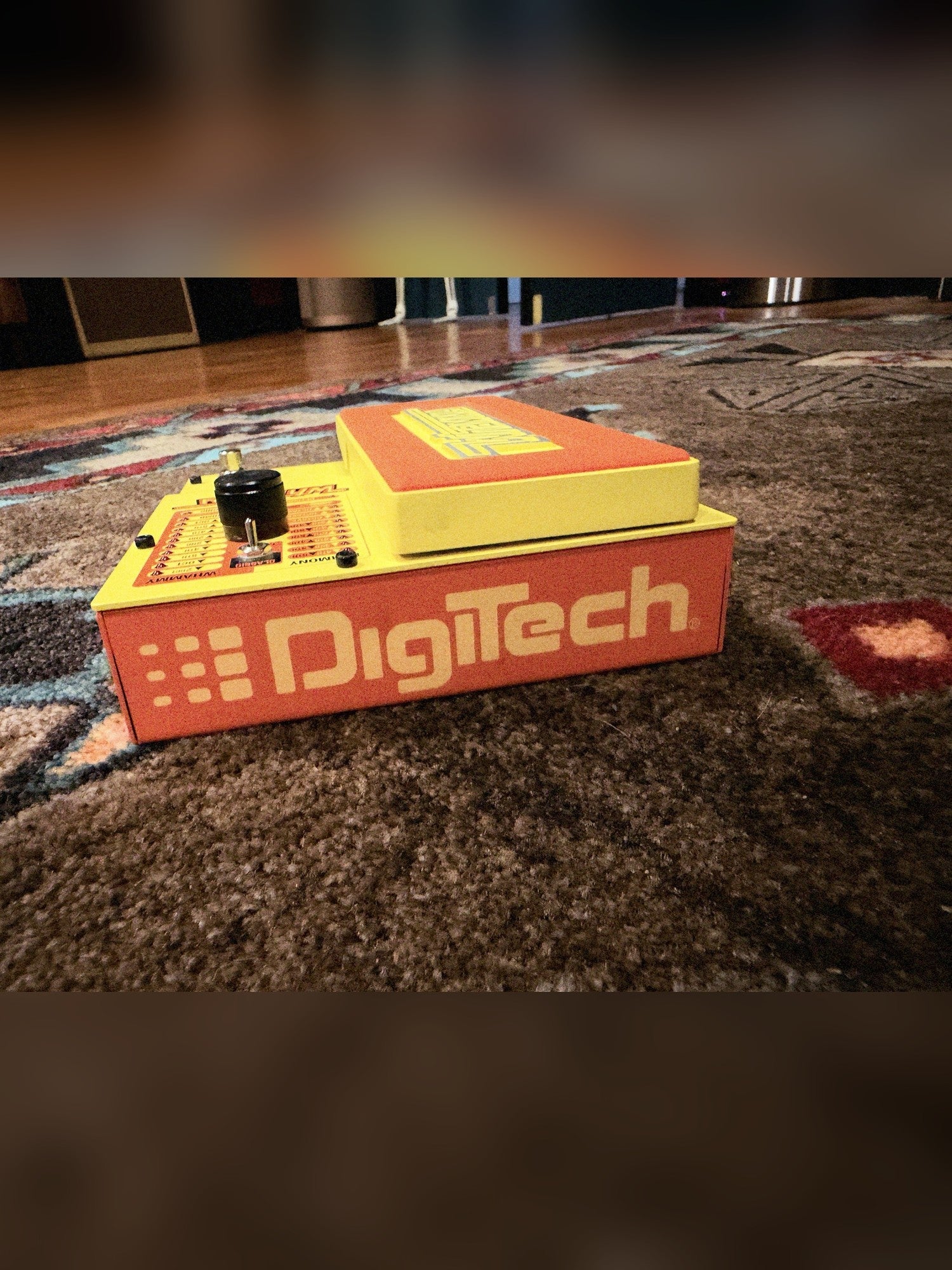 DigiTech MonoNeon Signature Whammy, neon orange and yellow: toe end with the DigiTech logo