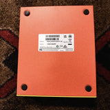 DigiTech MonoNeon Signature Whammy, neon orange and yellow: bottom plate with the model and serial number label and four rubber feet