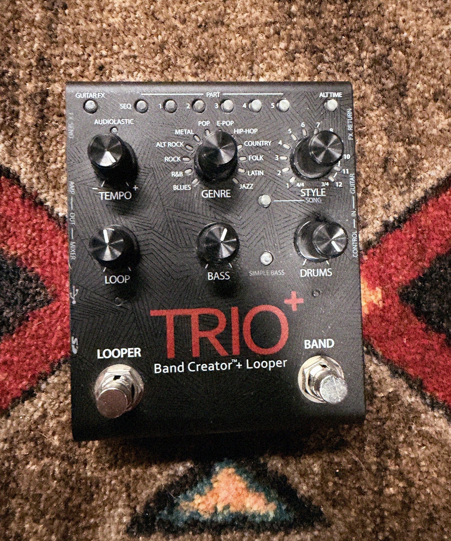 DigiTech Trio+ Band Creator + Looper, black: top with the Tempo, Genre, Style, Loop, Bass and Drums knobs, the Part buttons and the Looper and Band footswitches