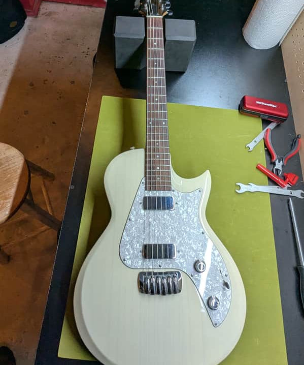 2007 Taylor SB1-X Solidbody Classic - front full body trans white - Pauls Guitar Hideout