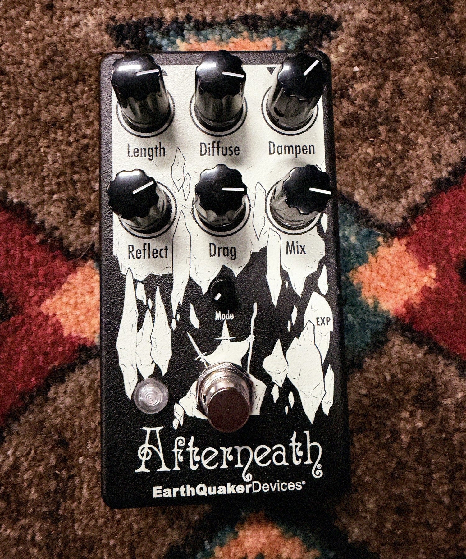 EarthQuaker Devices Afterneath V3, black: top with the Length, Diffuse, Dampen, Reflect, Drag and Mix knobs, the Mode knob, the white cave artwork, the LED and the footswitch