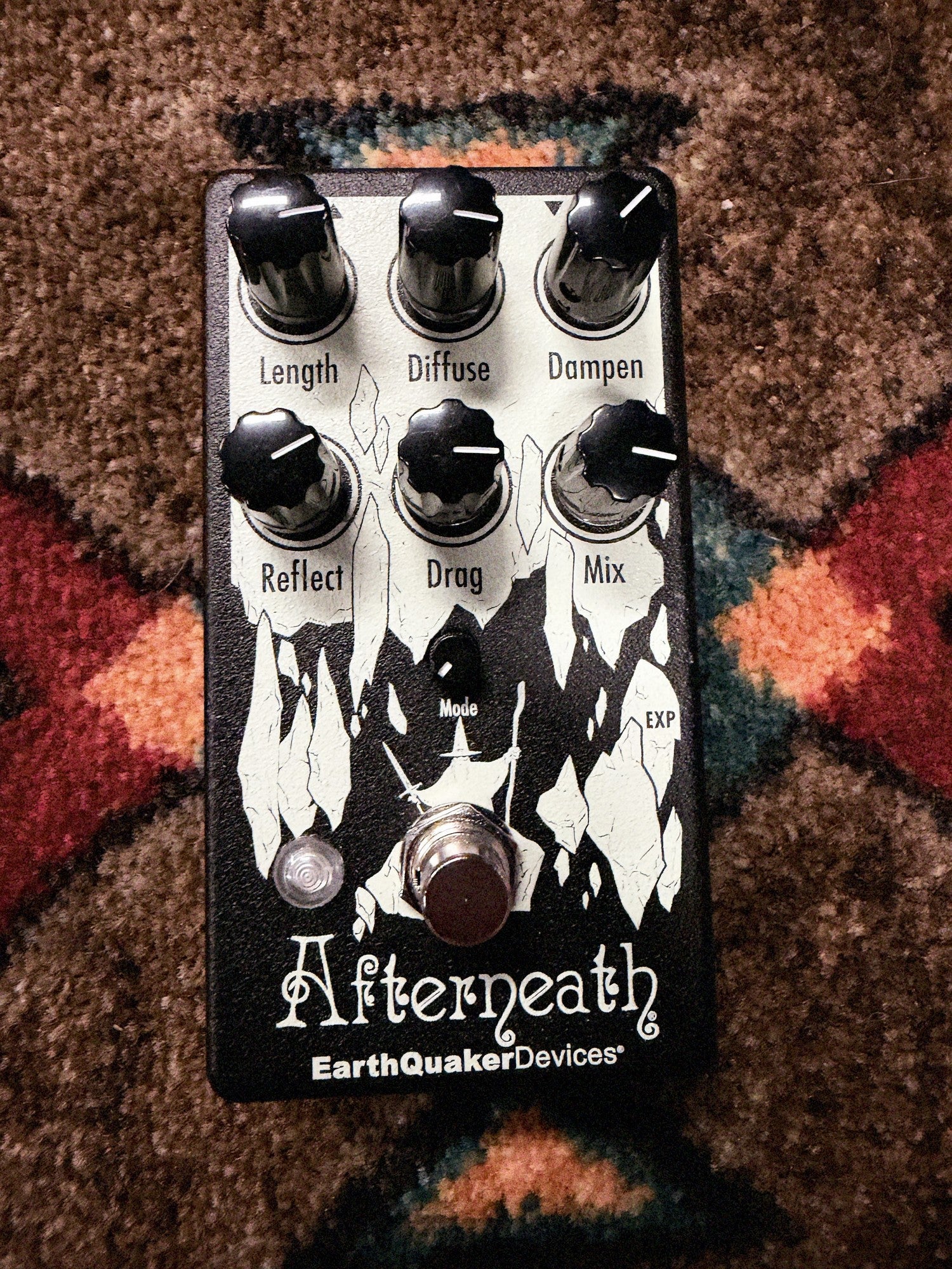 EarthQuaker Devices Afterneath V3, black: top with the Length, Diffuse, Dampen, Reflect, Drag and Mix knobs, the Mode knob, the white cave artwork, the LED and the footswitch