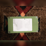 EarthQuaker Devices Plumes, green: bottom plate with four screws and a peeled, blank white label