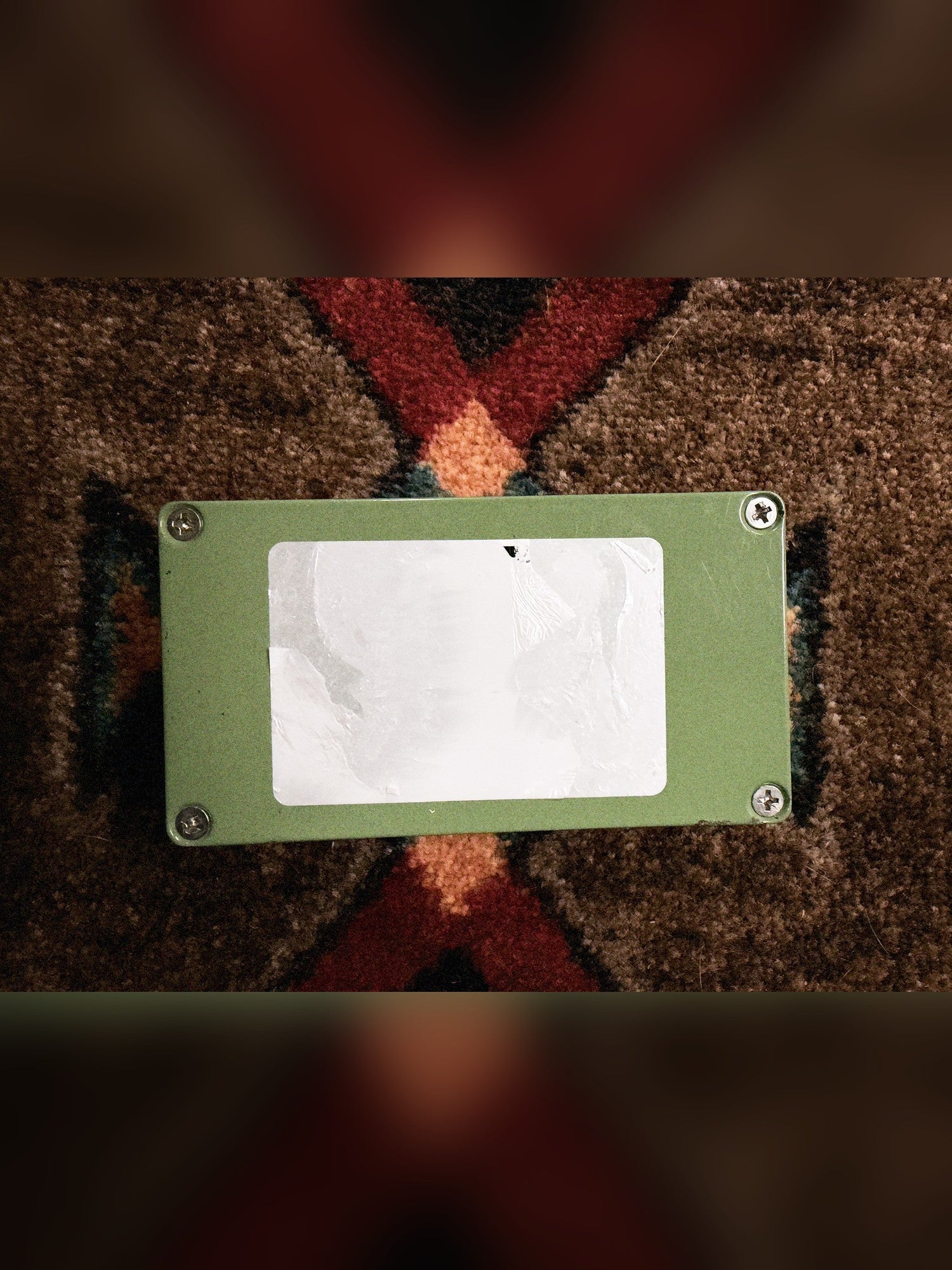 EarthQuaker Devices Plumes, green: bottom plate with four screws and a peeled, blank white label