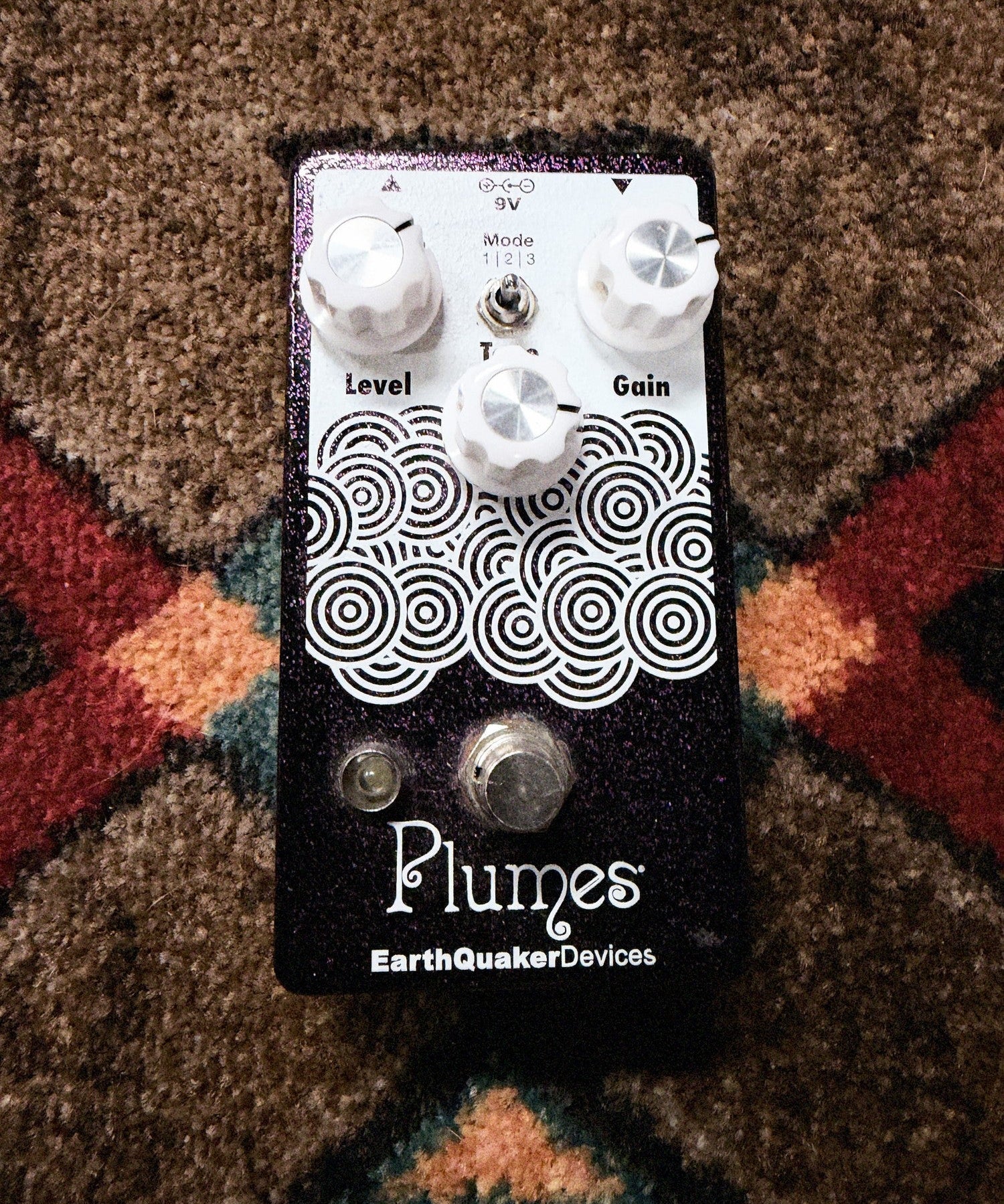 EarthQuaker Devices Plumes, purple sparkle: top with the Level, Tone and Gain knobs, the Mode toggle, the white circle artwork and the footswitch