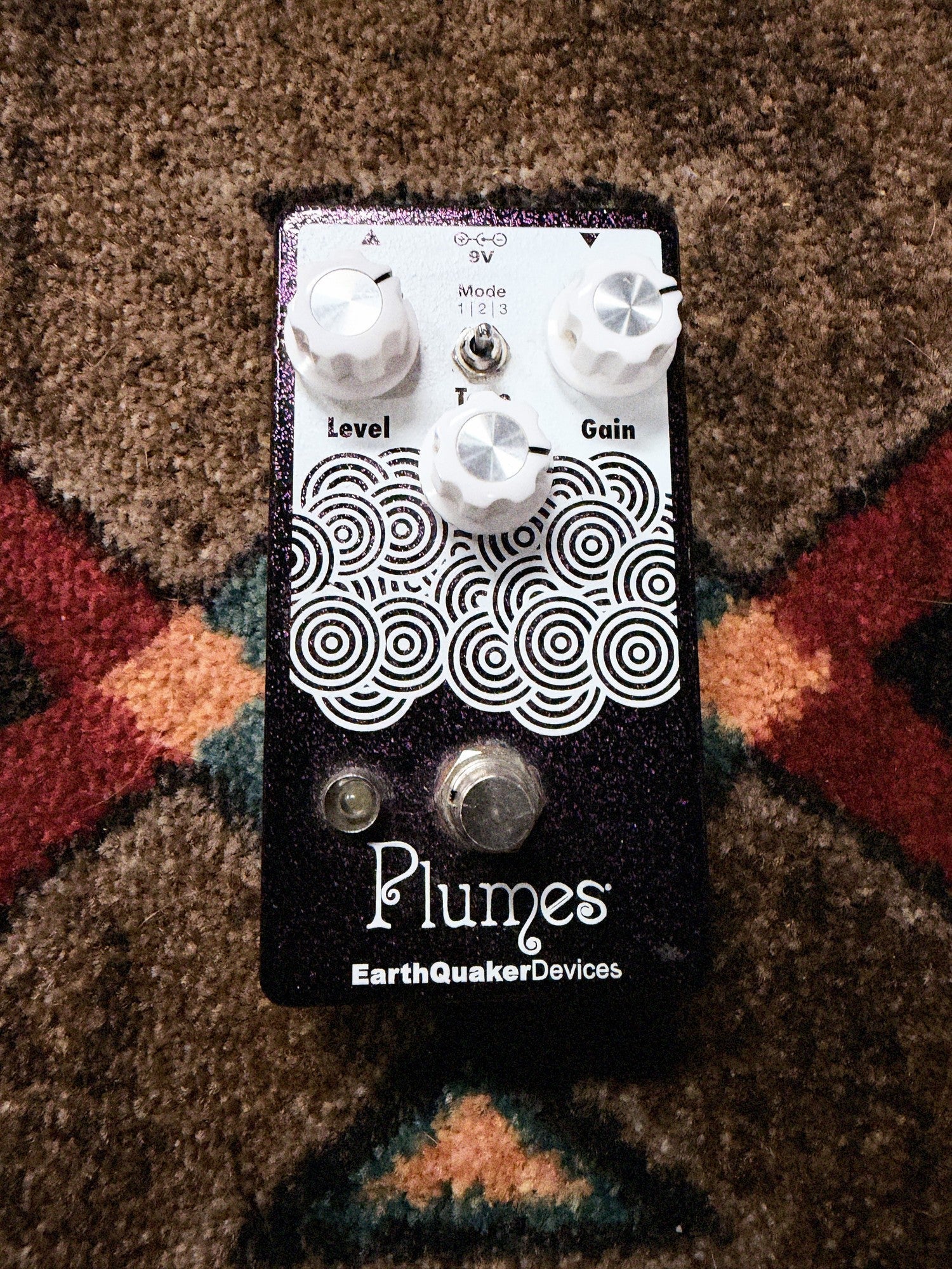 EarthQuaker Devices Plumes, purple sparkle: top with the Level, Tone and Gain knobs, the Mode toggle, the white circle artwork and the footswitch