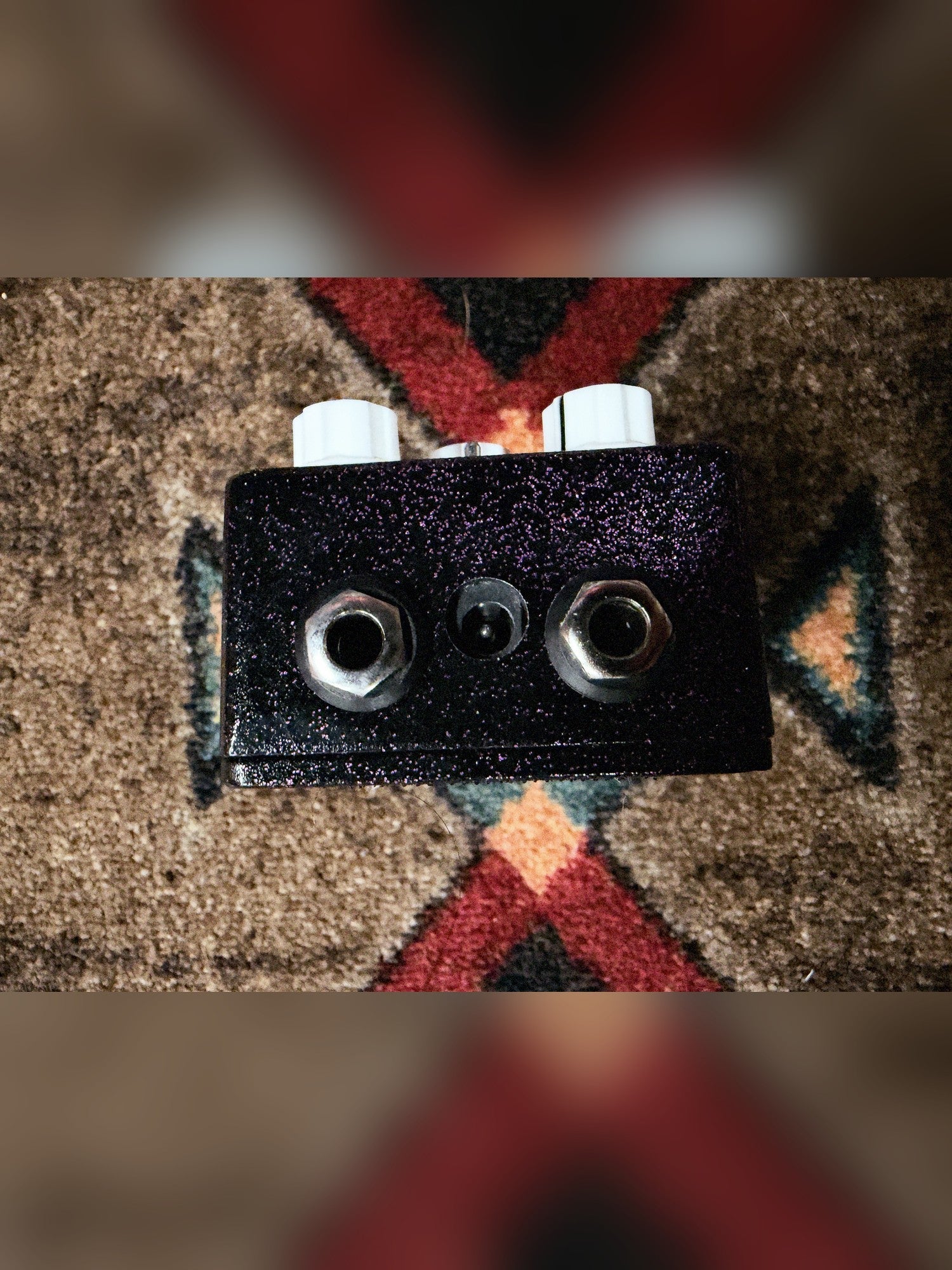 EarthQuaker Devices Plumes, purple sparkle: top end with the two jacks and the power jack between them