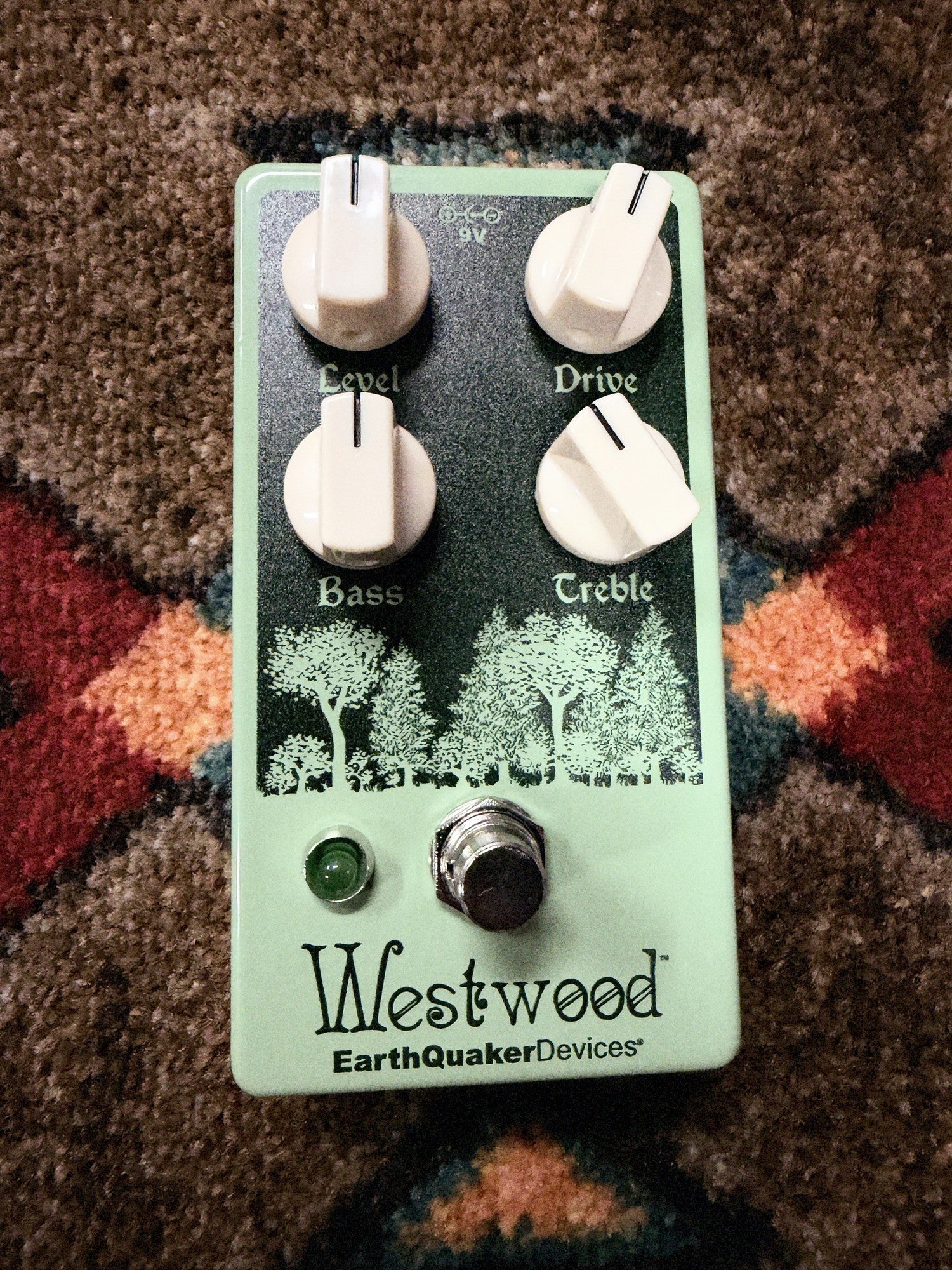 EarthQuaker Devices Westwood, seafoam green: top with the Level, Drive, Bass and Treble knobs, the forest artwork, the green LED and the footswitch