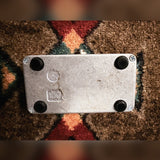 Electro-Harmonix Bad Stone, silver and black: bottom plate with four rubber feet, four screws, cast markings and dark stains