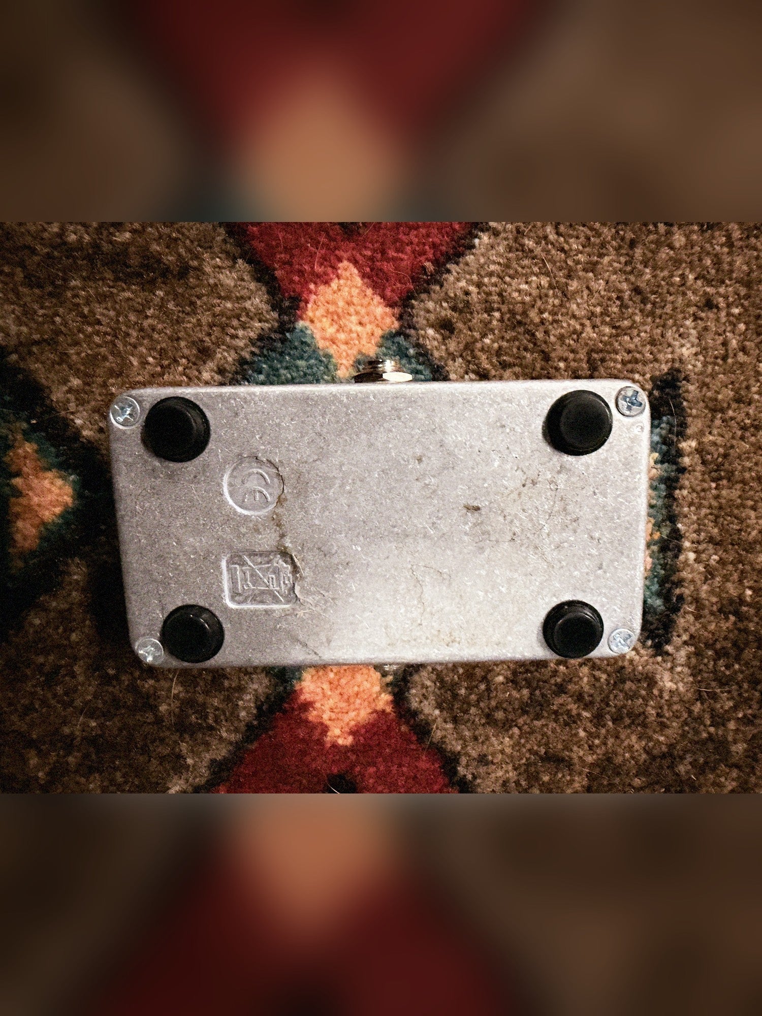 Electro-Harmonix Bad Stone, silver and black: bottom plate with four rubber feet, four screws, cast markings and dark stains