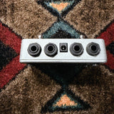 Electro-Harmonix Switchblade Plus, black and blue: top end with the Input, Tuner, Out A and Out B jacks and the power jack