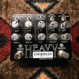 Empress Effects Heavy, black: top with the ten knobs, the gate and mid freq switches, the heavy and heavier footswitches and dark marks on the heavy footswitch cap