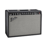 Fender '65 Deluxe Reverb combo amp from the front right, showing the Normal and Vibrato channel controls and red jewel light