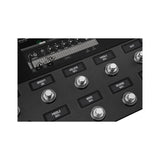 Fender Tone Master Pro footswitches close-up, LCD labels showing amp controls for volume, treble, middle, bass and reverb