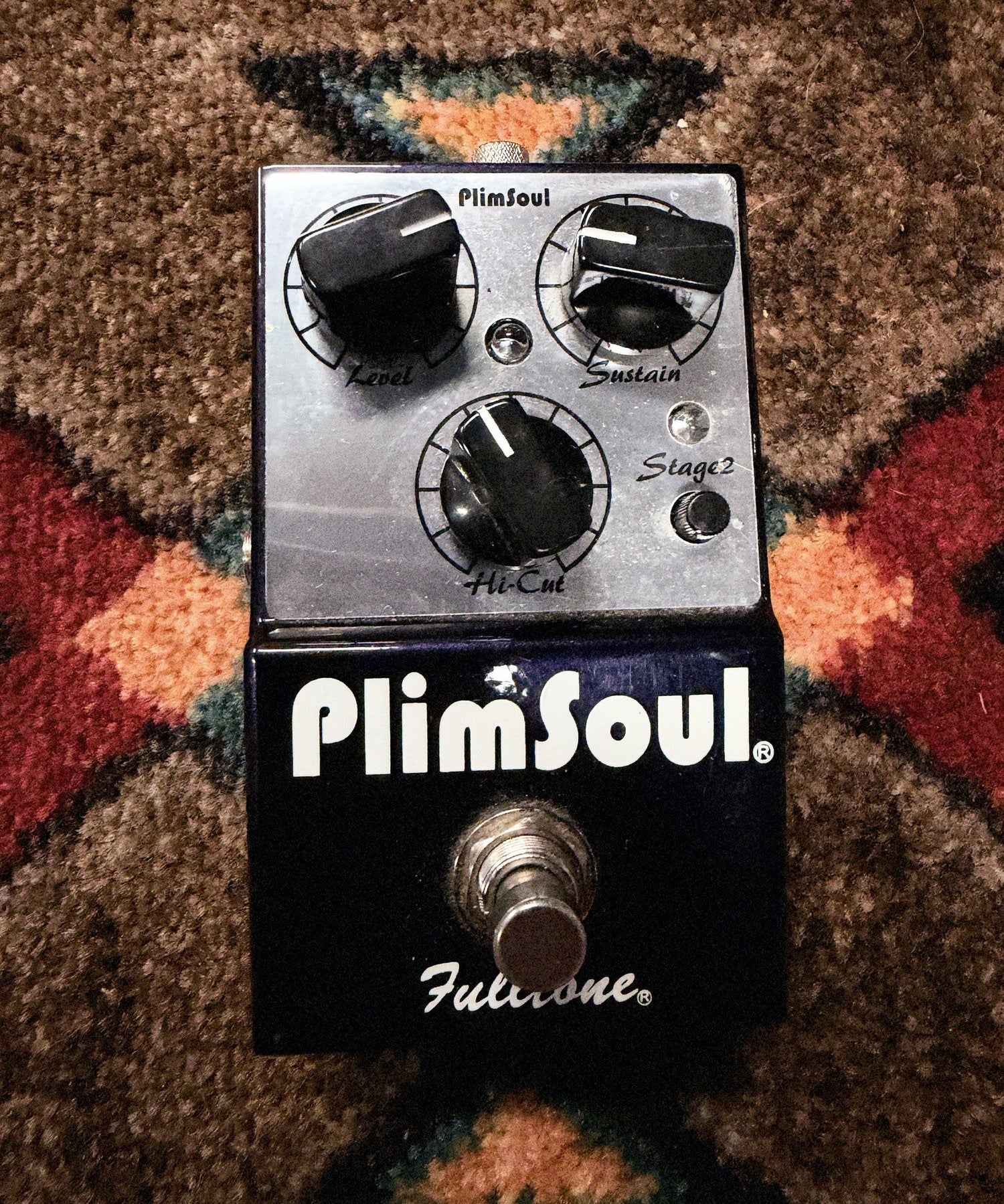 Fulltone PlimSoul, dark blue and silver: top with the Level, Sustain, Hi-Cut and Stage 2 knobs, two LEDs, the footswitch and a small paint chip above the logo