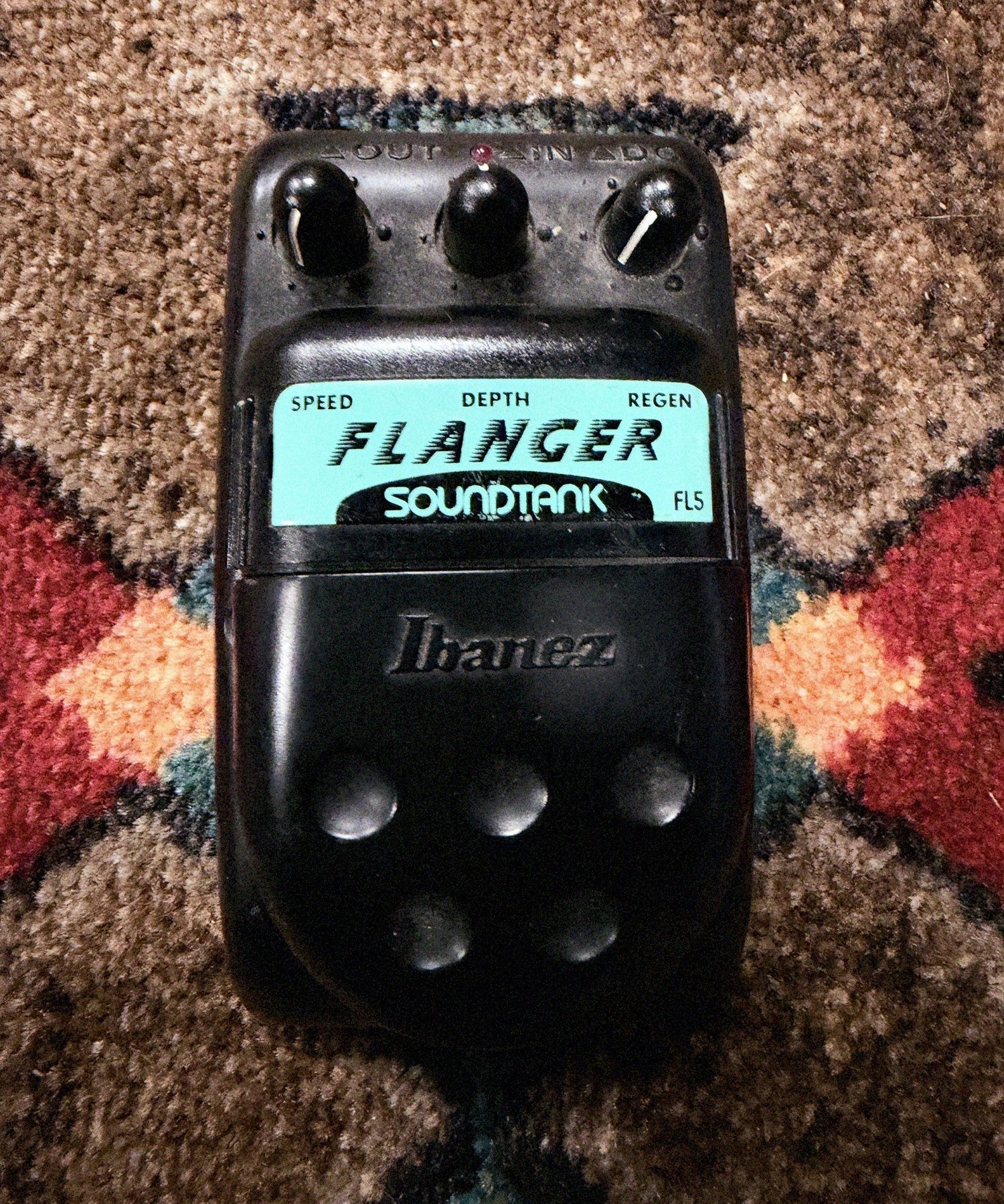 Ibanez Soundtank FL5 Flanger, black: top with the Speed, Depth and Regen knobs, the red LED, the teal Flanger label and the Ibanez pedal