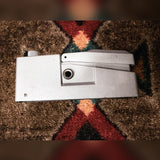 Ibanez TS7 Tube Screamer, silver: left side with the output jack, a small dark smudge near the knob end