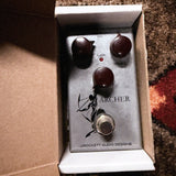 J. Rockett Audio Designs Archer, silver: the pedal sitting in its open J. Rockett box