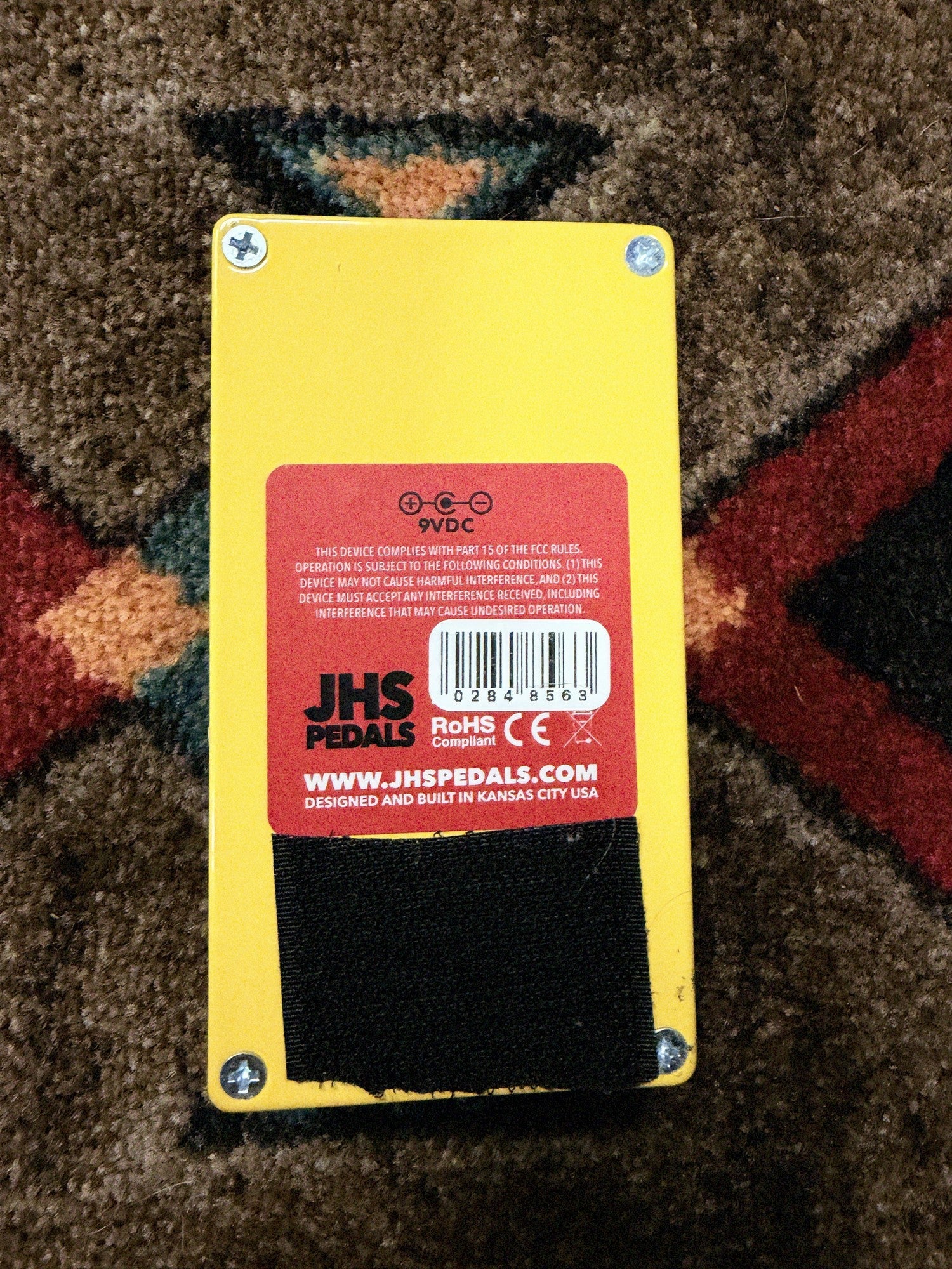 JHS Double Dragon Lo-Fi Octave Device, yellow: bottom with the JHS Pedals label, Designed and Built in Kansas City USA, and serial sticker 0284 8563