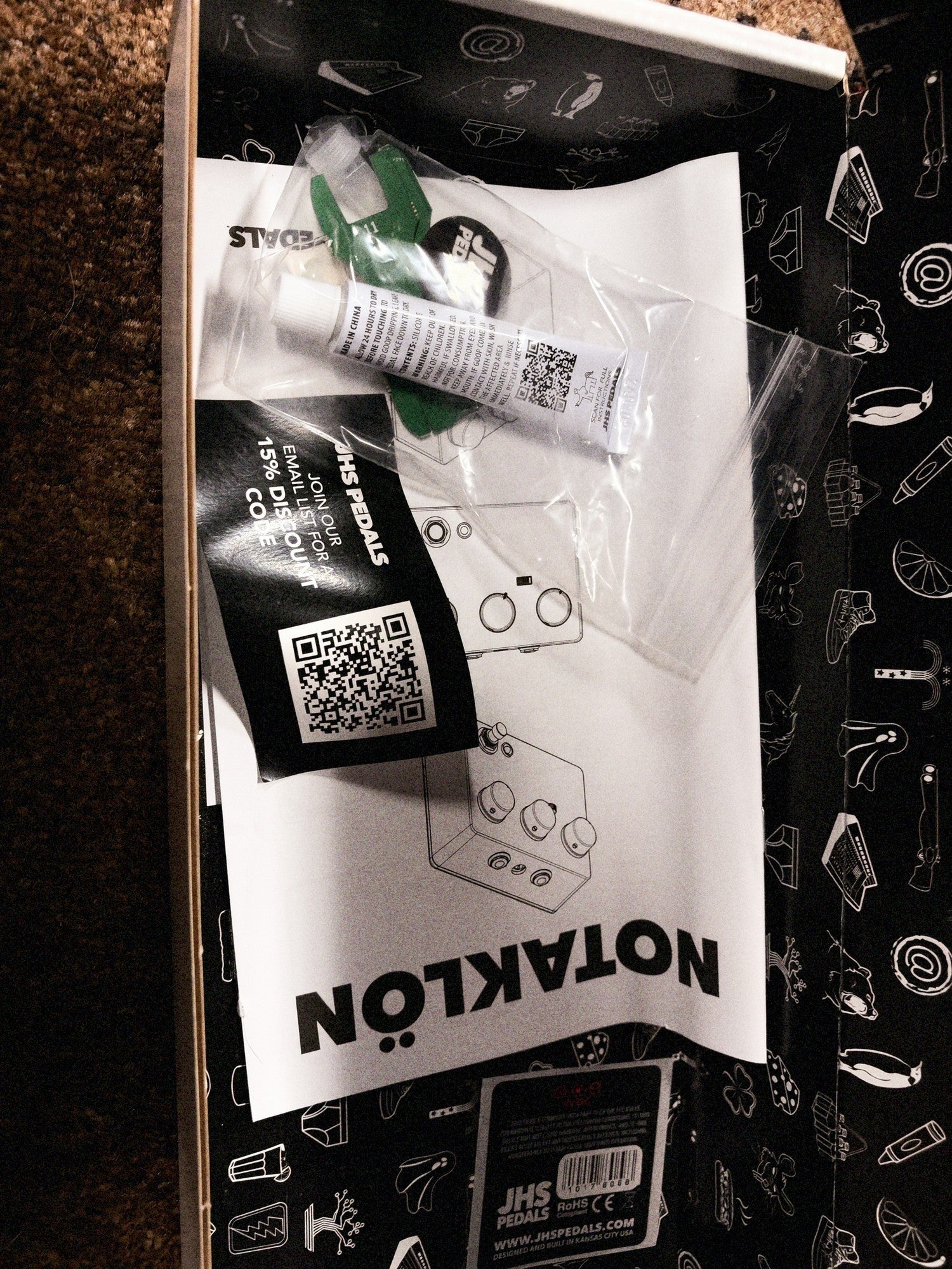 JHS Notaklön, white: the goop tube, green plastic wrench and instructions left from the kit