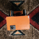 KMD Overdrive, orange: back end with the power jack below the knobs