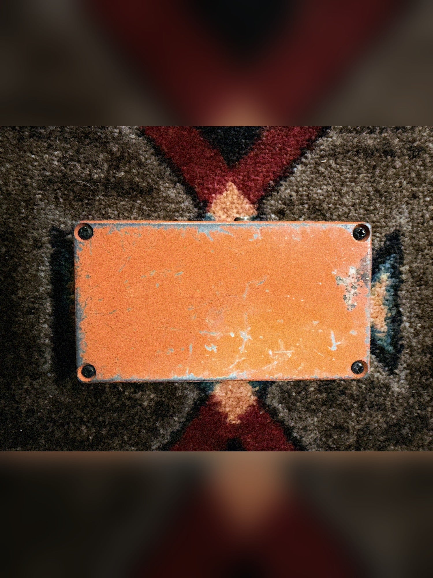 KMD Overdrive, orange: bottom plate with four screws and the paint worn through at the edges