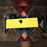 MXR M104 Distortion+, yellow: left side with the output jack and a few small chips along the bottom edge