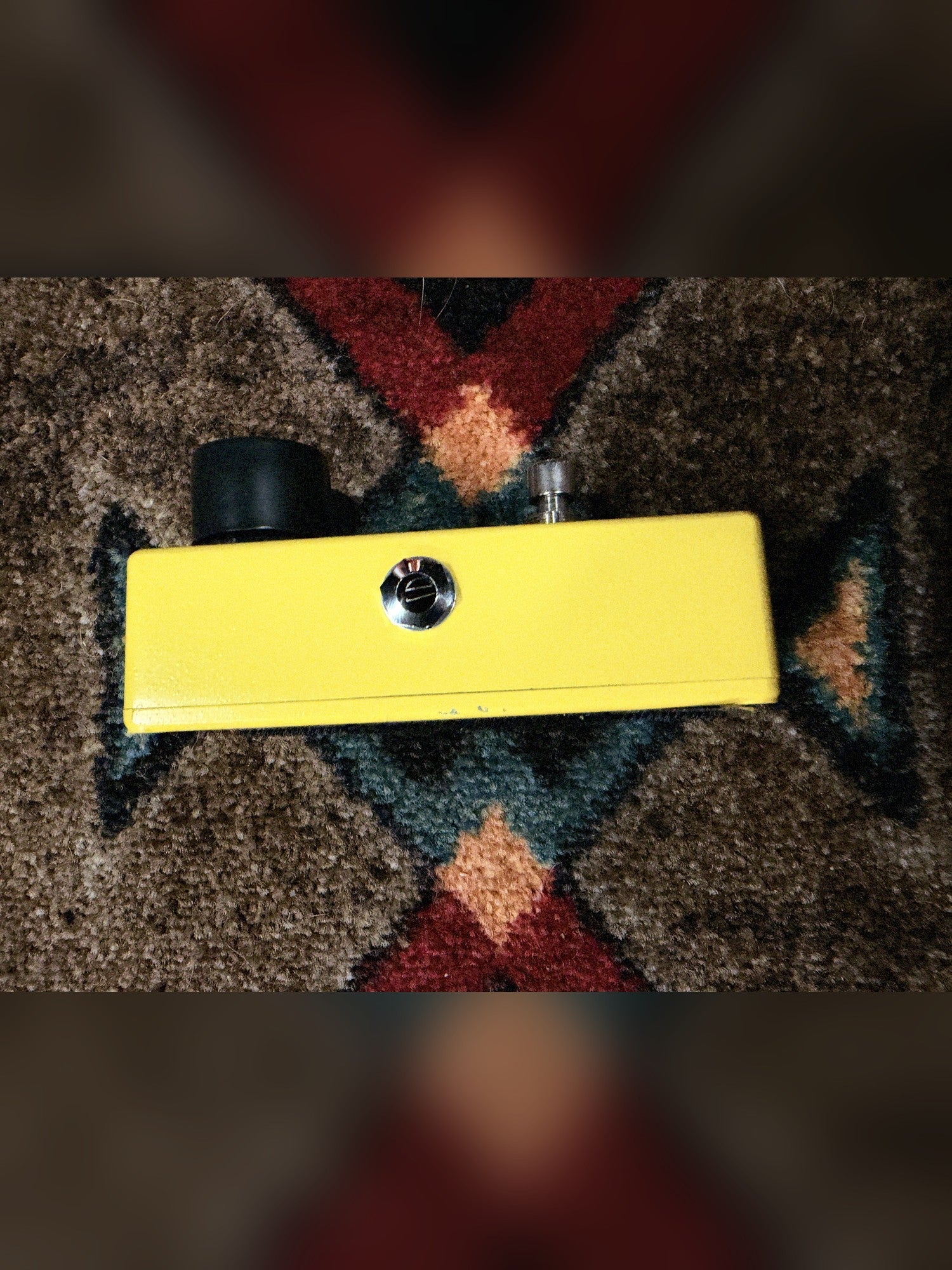 MXR M104 Distortion+, yellow: left side with the output jack and a few small chips along the bottom edge