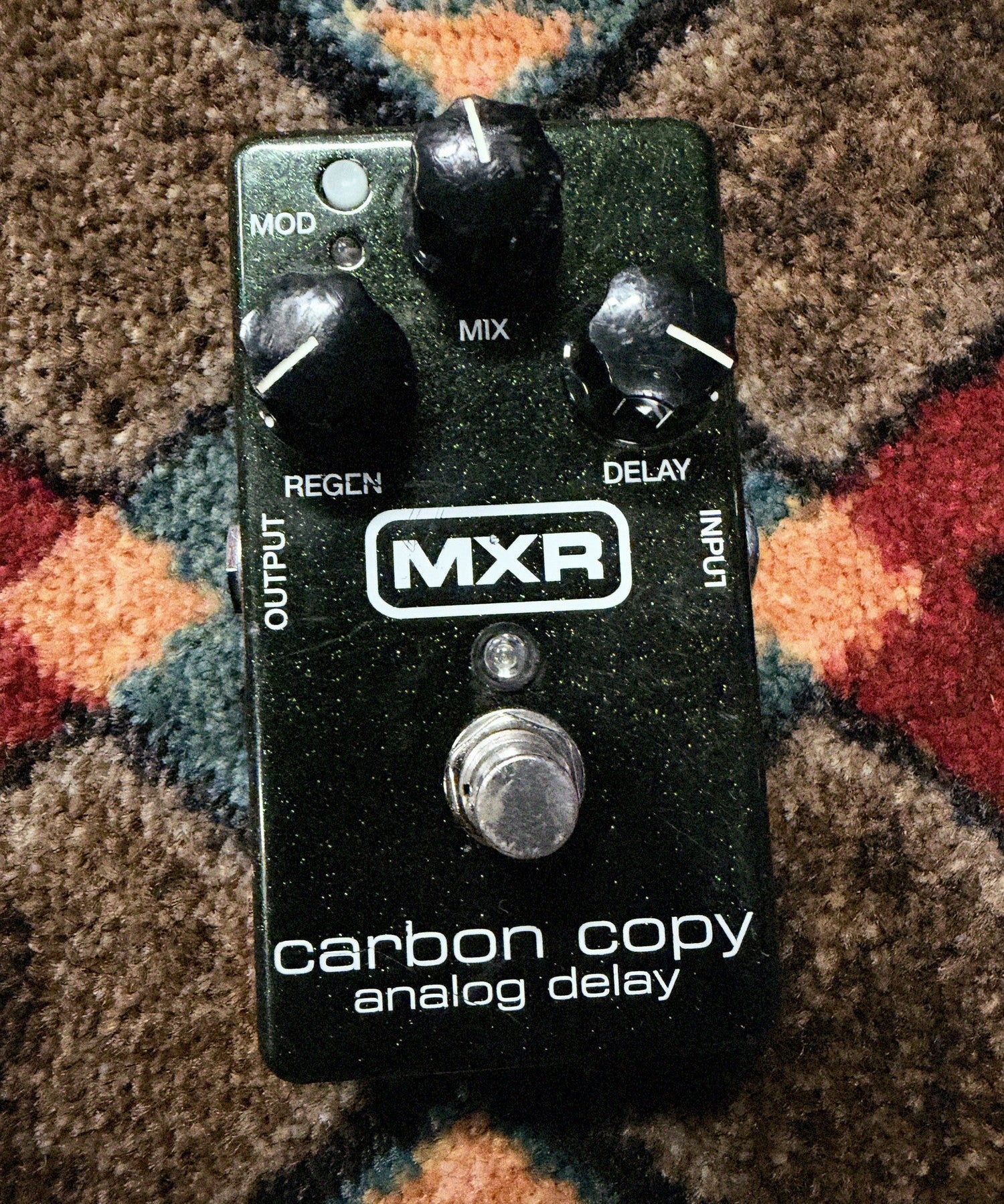 MXR M169 Carbon Copy Analog Delay, dark green sparkle: top with the Mix, Regen and Delay knobs, the Mod button, the footswitch and light scratches by the MXR logo