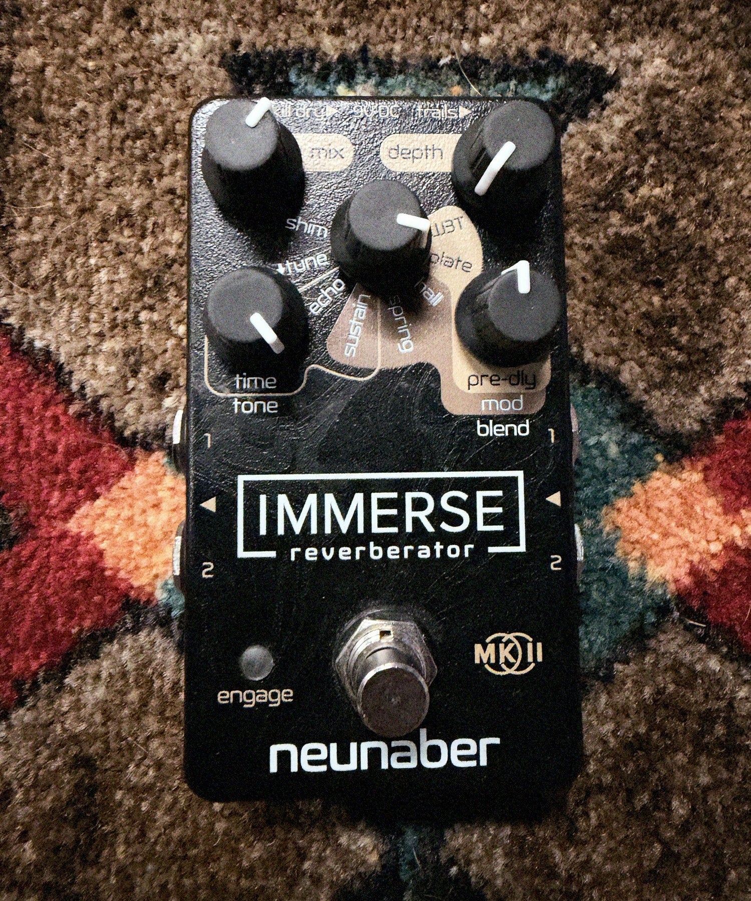 Neunaber Immerse Reverberator Mk II, black: top with the Mix, Depth and effect knobs, the Time/Tone and Pre-dly/Mod/Blend knobs, the Mk II badge, the footswitch and fine scratches above the Immerse logo
