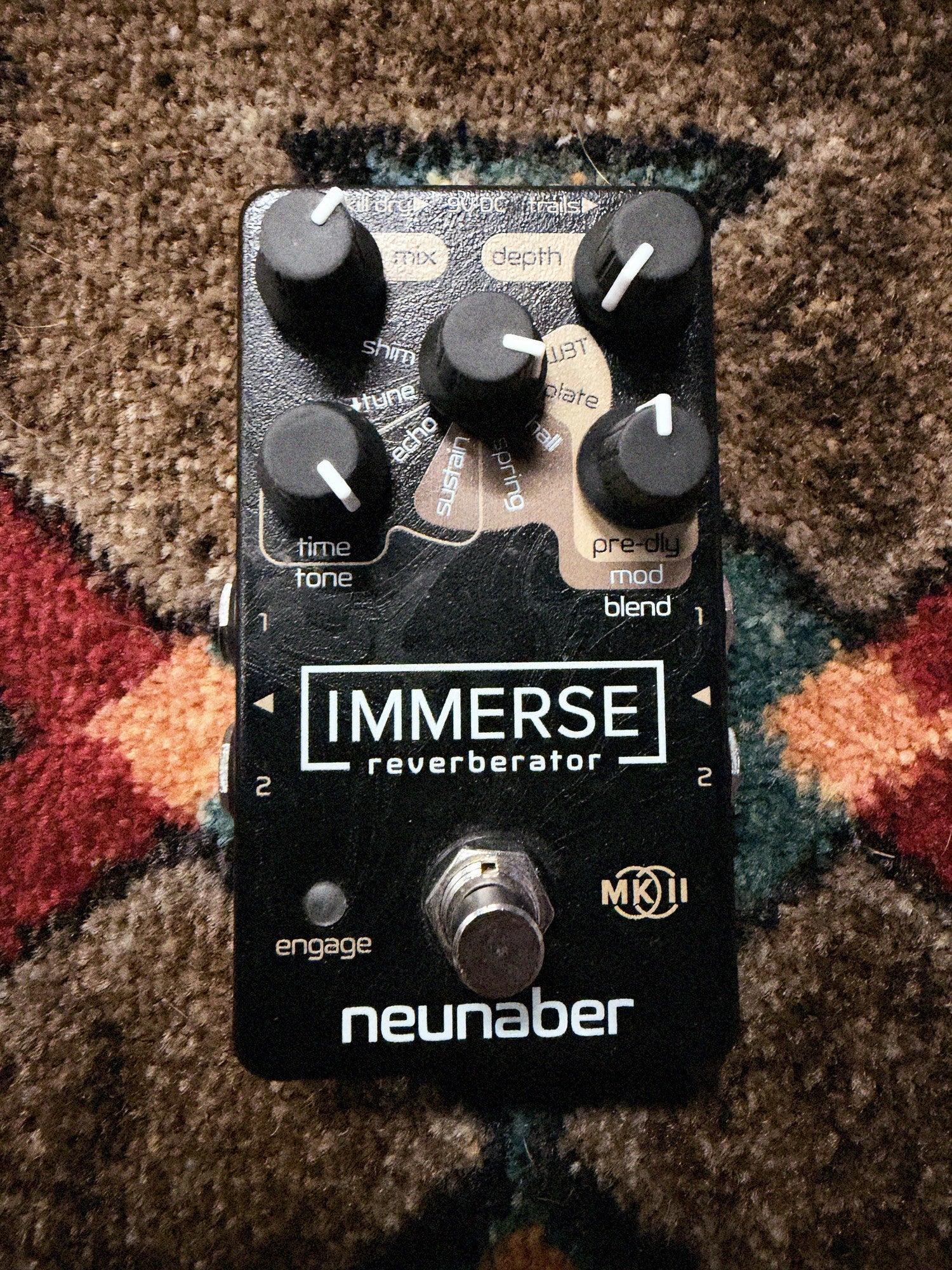 Neunaber Immerse Reverberator Mk II, black: top with the Mix, Depth and effect knobs, the Time/Tone and Pre-dly/Mod/Blend knobs, the Mk II badge, the footswitch and fine scratches above the Immerse logo