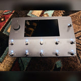 Neural DSP Quad Cortex, gray: top panel powered on with all eleven footswitches lit and the touchscreen