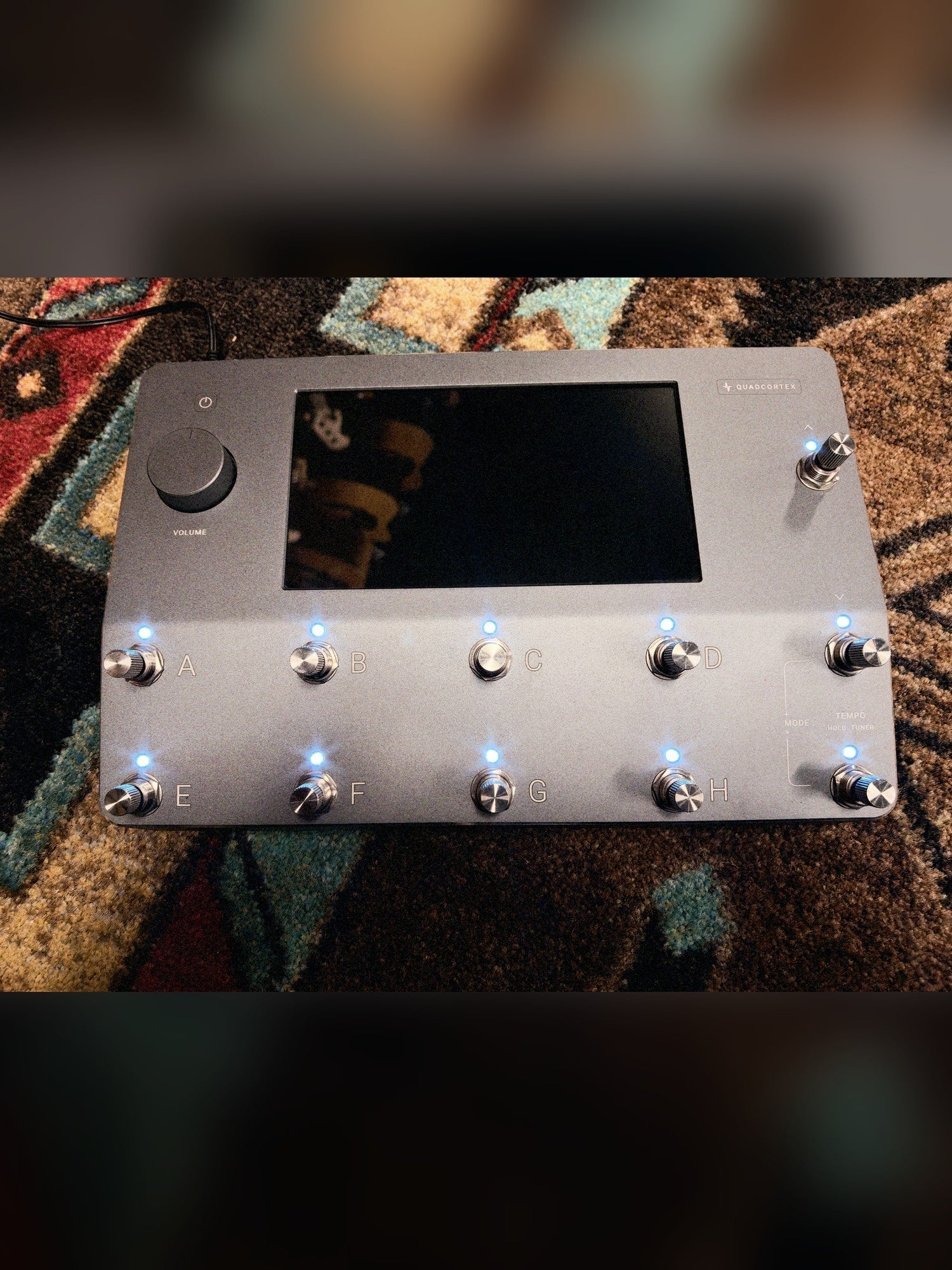 Neural DSP Quad Cortex, gray: top panel powered on with all eleven footswitches lit and the touchscreen