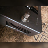 Neural DSP Quad Cortex, gray: side panel vents and the top-right footswitch
