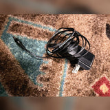 Neural DSP Quad Cortex, gray: the power supply that comes with it, cable coiled