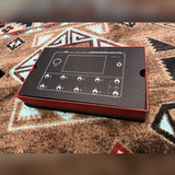 Neural DSP Quad Cortex, gray: open box with the printed insert showing the footswitch layout