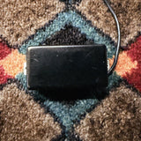 Porter Clear humbucker, bridge, black cover: front of the cover with no pole holes, with its lead