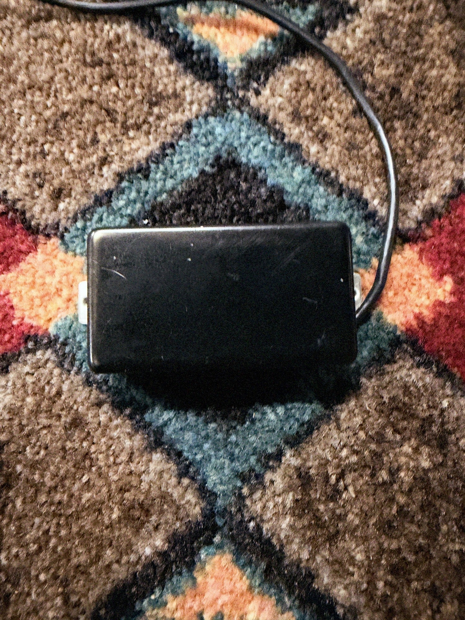 Porter Clear humbucker, bridge, black cover: front of the cover with no pole holes, with its lead