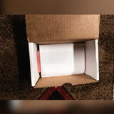 RYRA The Klone, dark blue sparkle: the open box with the folded paper sheet and foam inside