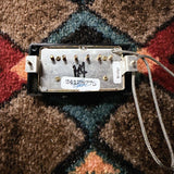 Seymour Duncan Antiquity Humbucker, aged gold: baseplate with the Bridge sticker, the serial sticker with a signature and a hand-written marker mark