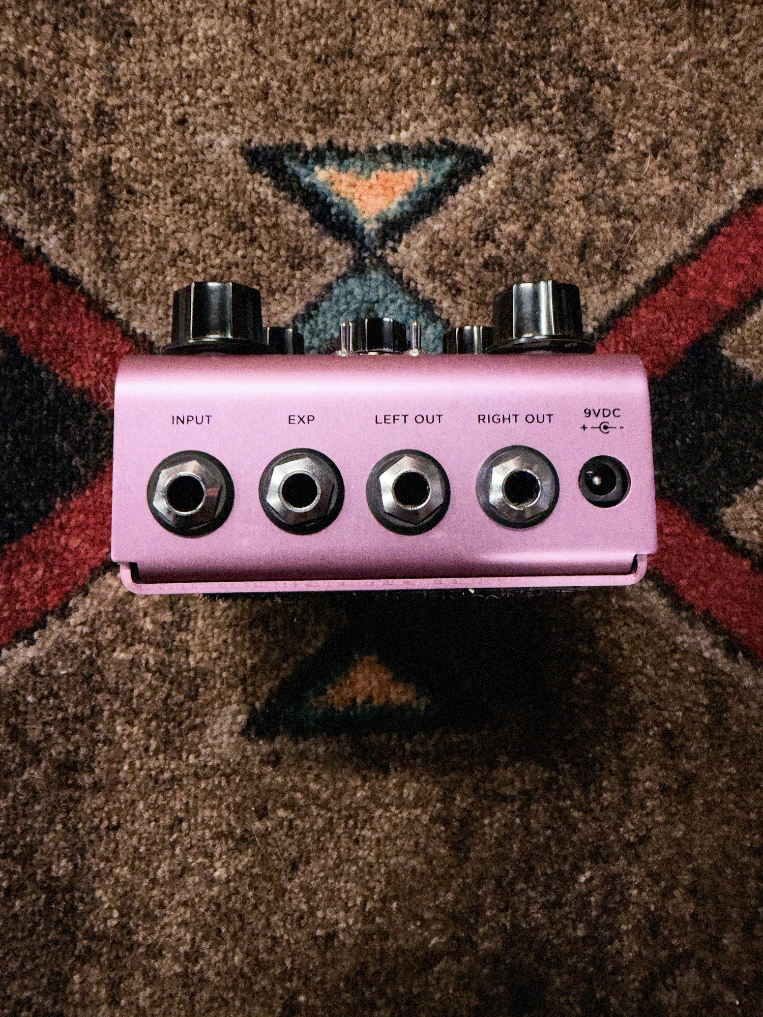 Strymon DIG Dual Digital Delay V1, lavender: back end with the Input, EXP, Left Out and Right Out jacks and the 9VDC power jack
