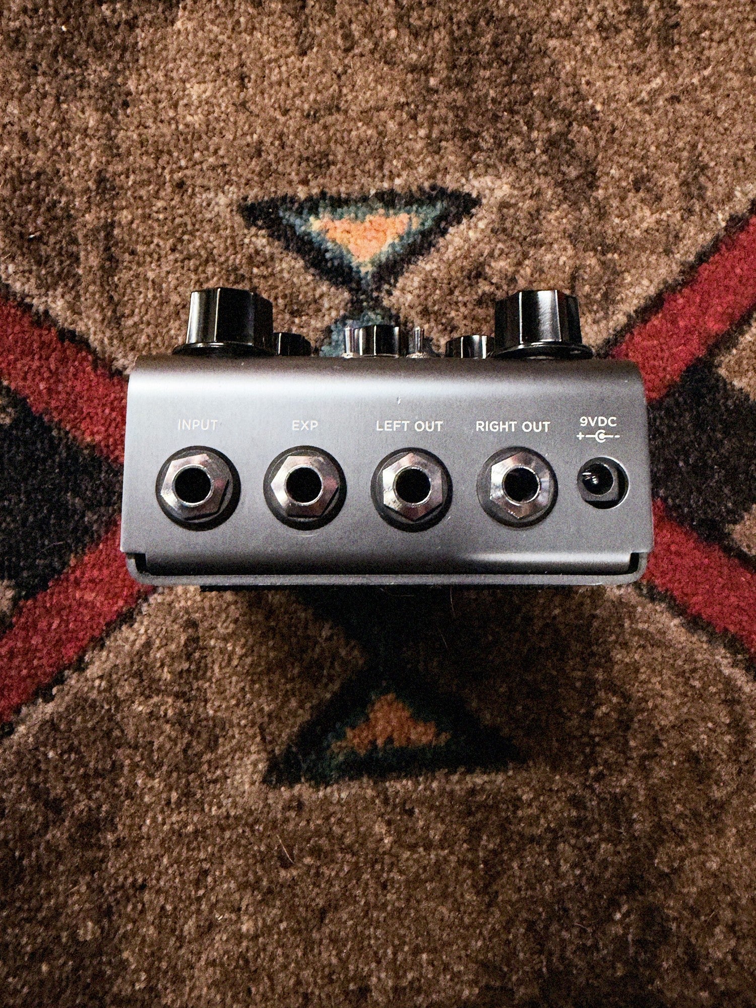 Strymon El Capistan dTape Echo V1, gunmetal gray: back end with the Input, EXP, Left Out and Right Out jacks and the 9VDC power jack