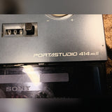 Tascam Portastudio 414 MKII, blue: tape counter and the Portastudio 414 MKII badge