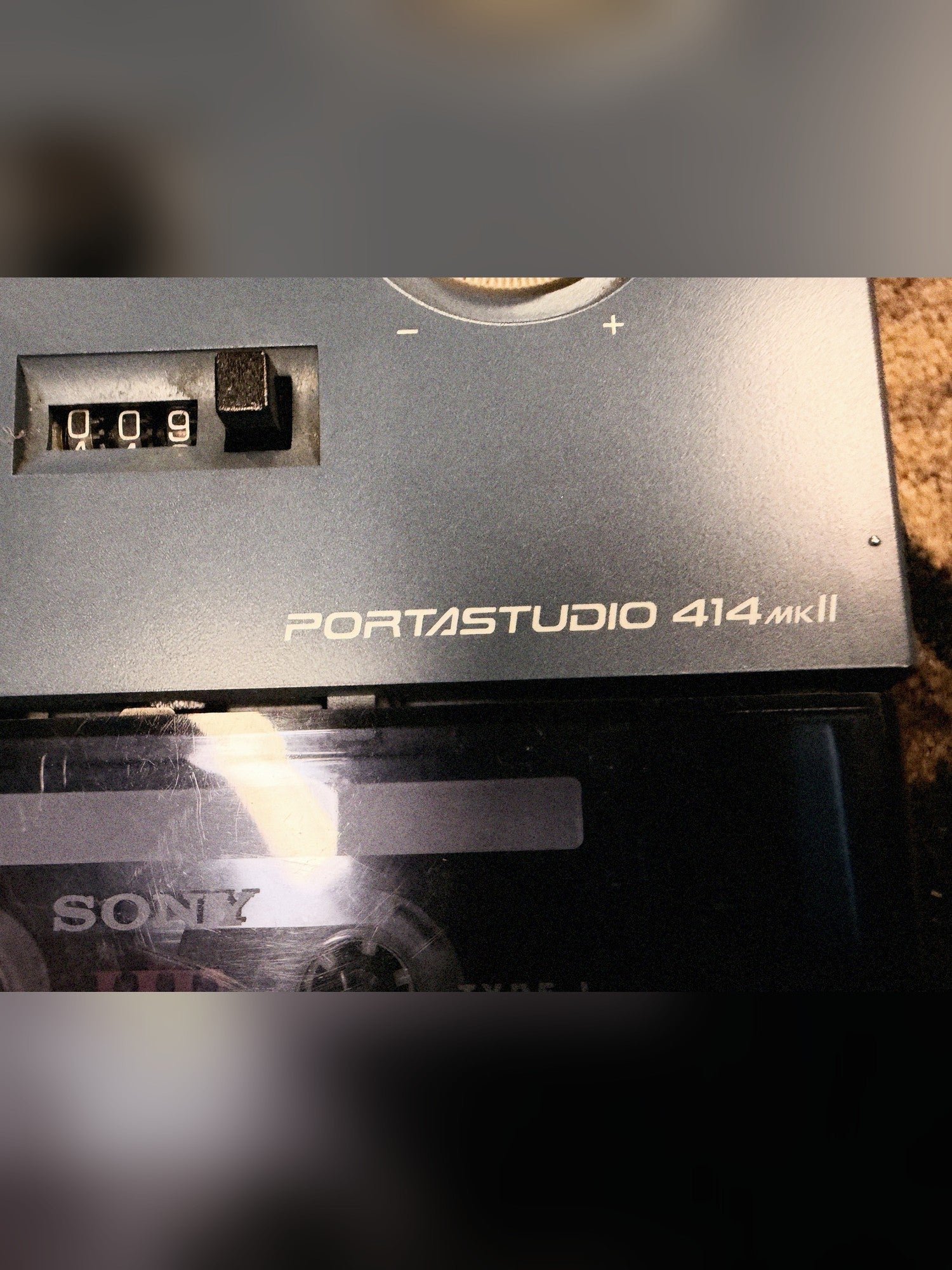 Tascam Portastudio 414 MKII, blue: tape counter and the Portastudio 414 MKII badge