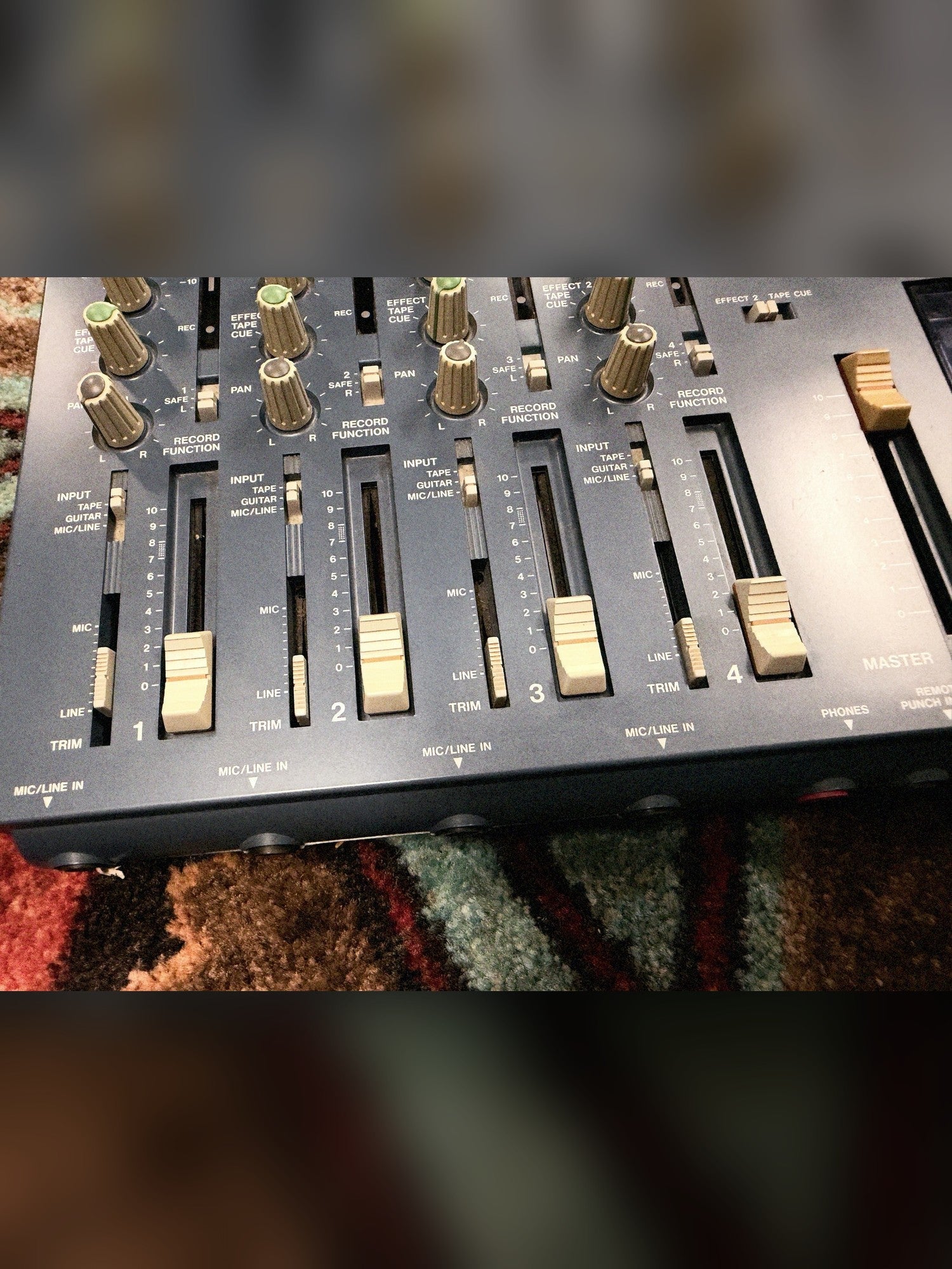 Tascam Portastudio 414 MKII, blue: channel faders and the master fader
