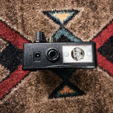 Tech 21 SansAmp Acoustic DI, black: left end with the power jack, the 1/4 inch output and the XLR output
