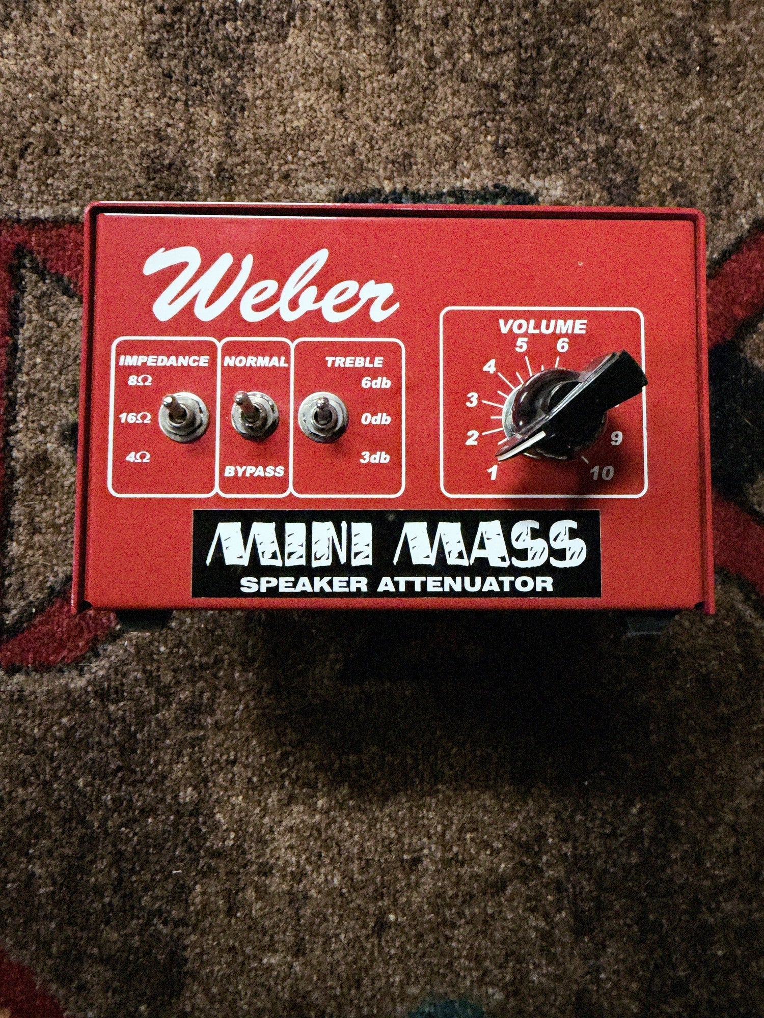 Weber MiniMASS 50-watt attenuator, red: front panel with the Impedance, Normal and Bypass, and Treble switches and the Volume knob