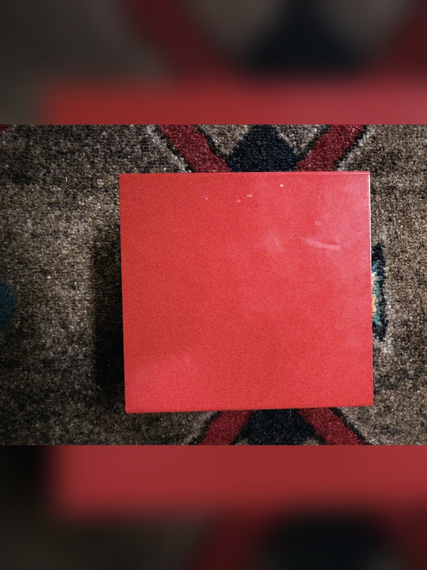 Weber MiniMASS 50-watt attenuator, red: top of the enclosure, with a few small light specks near one edge